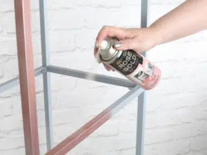 using spray paint to paint metal frame