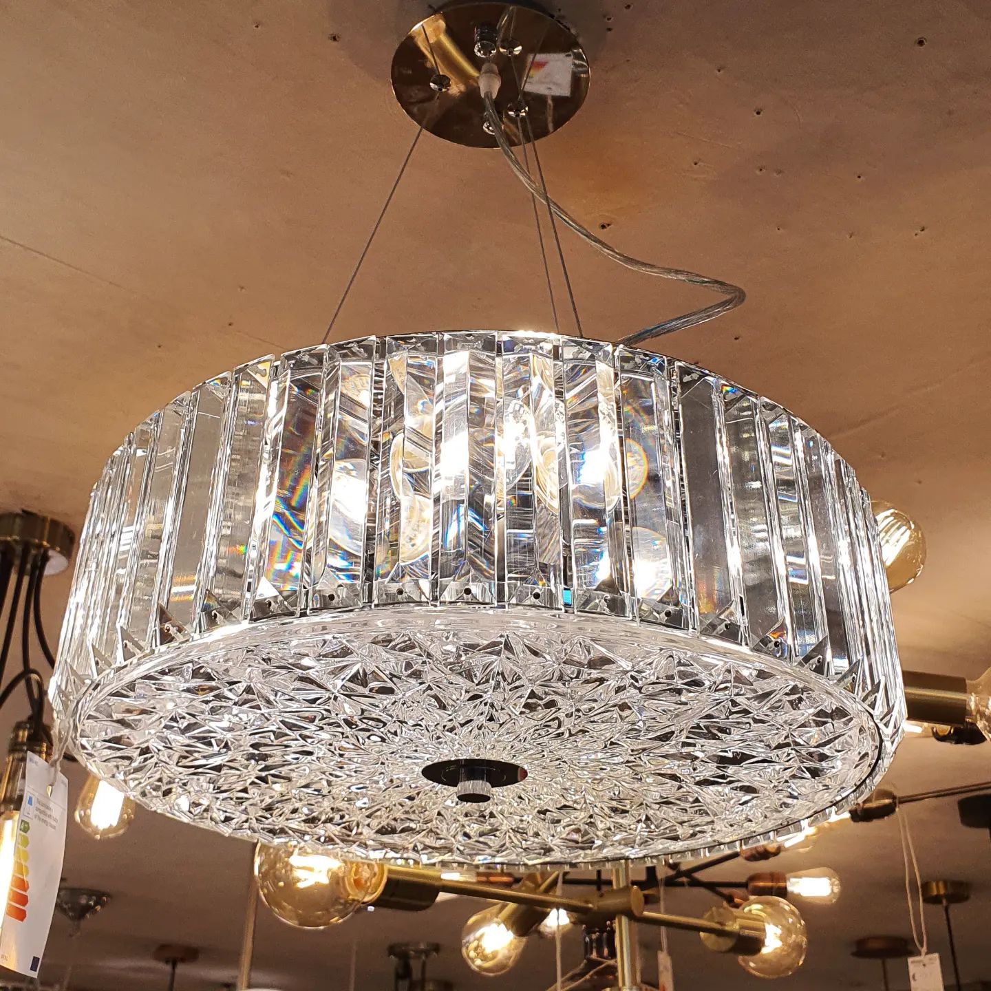 This 6 light crystal pendant takes the traditional crystal and updates it with beautiful sparkling faceted crystal mounted in a chrome frame with a decorative clear glass diffuser. This stunning design will be a striking display for modern or traditional decors. This pendant is fully height adjustable at the point of installation. 💡

Available today in-store.