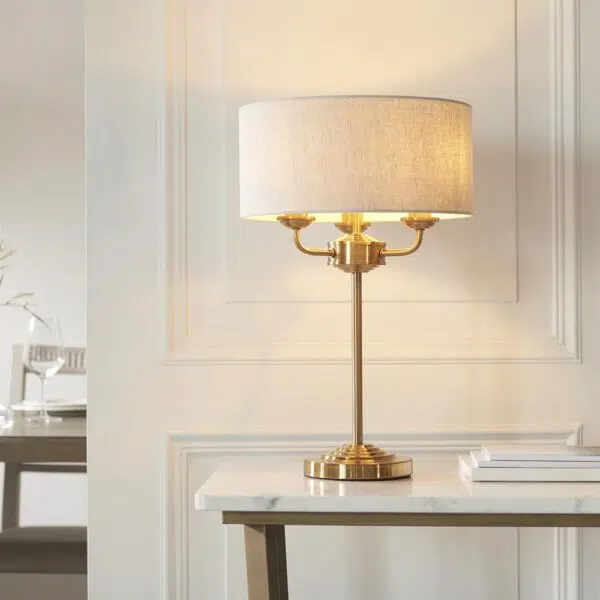 elegant 3 arm table lamp aged brass with natural shade - Stillorgan Decor