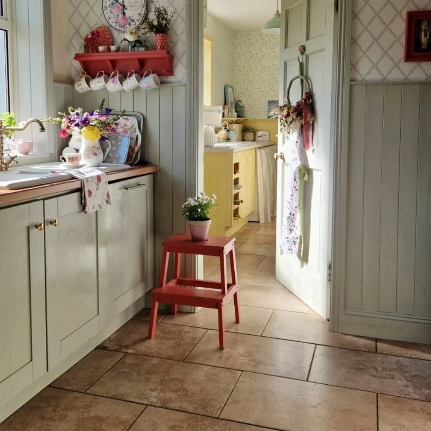 How charming is @cooneynest’s vintage kitchen, peeking through her yellow utility room?

The kitchen paneling, door, and units are painted with Helmi 30 in 🎨 Pickle, while the utility room is painted in 🎨 Lemonade.
