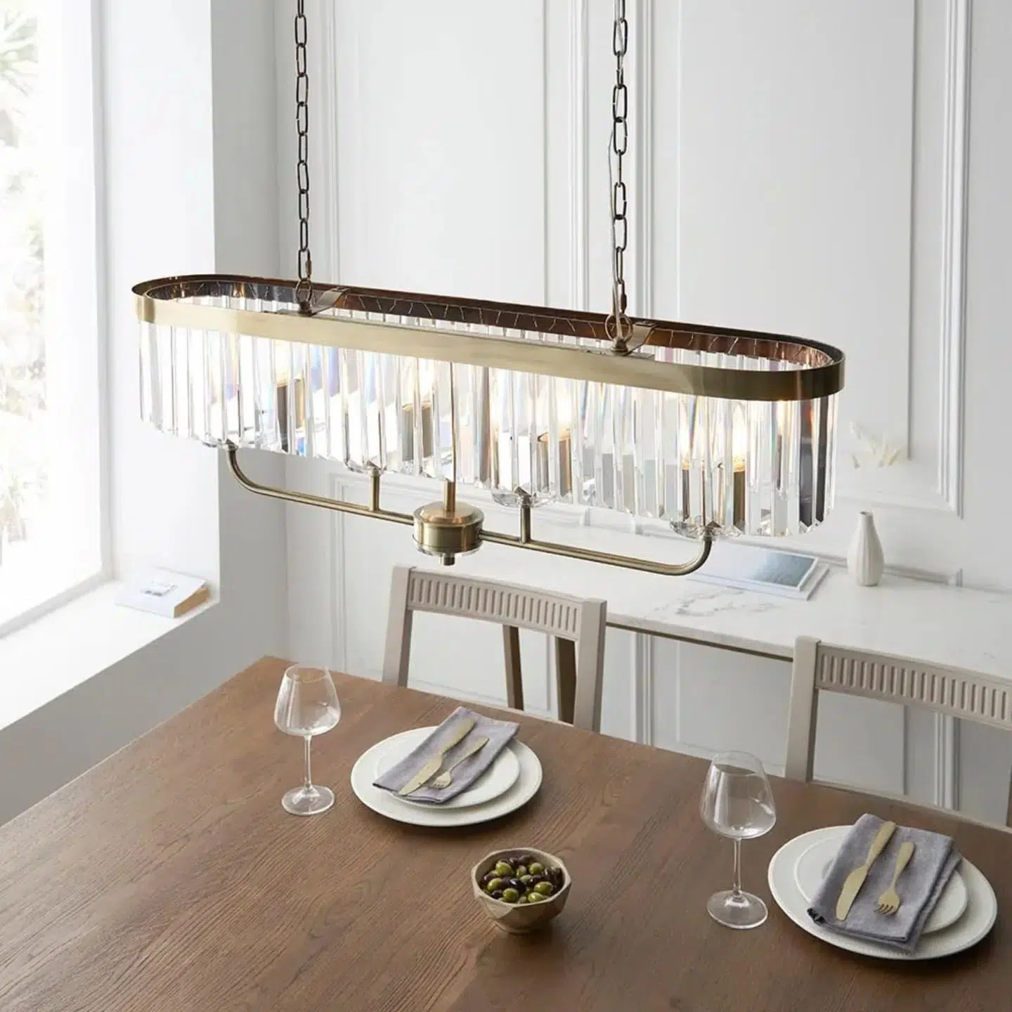 A design classic, this opulent antique brass cut glass linear pendant light works equally well in contemporary or classic interiors. This timeless antique brass plate chandelier is surrounded by faceted clear glass which creates striking light patterns. 💡

Product code: 07110539SD
