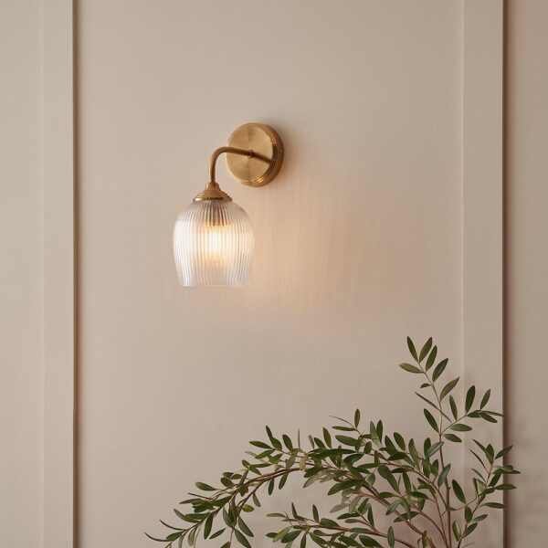 elegant arched arm clear ribbed glass shade wall light in warm brass - Stillorgan Decor