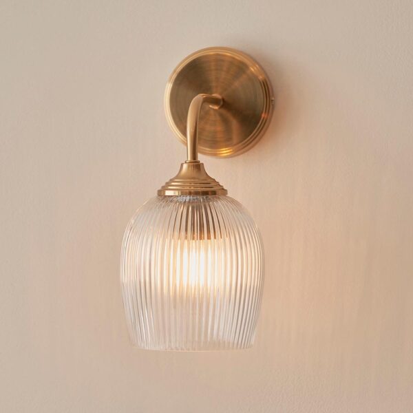 elegant arched arm clear ribbed glass shade wall light in warm brass - Stillorgan Decor