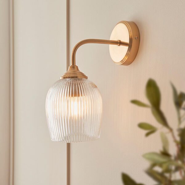 elegant arched arm clear ribbed glass shade wall light in warm brass - Stillorgan Decor