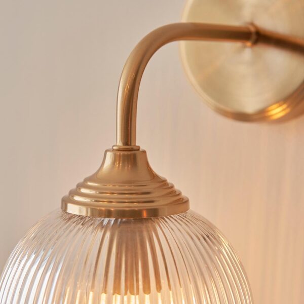 elegant arched arm clear ribbed glass shade wall light in warm brass - Stillorgan Decor