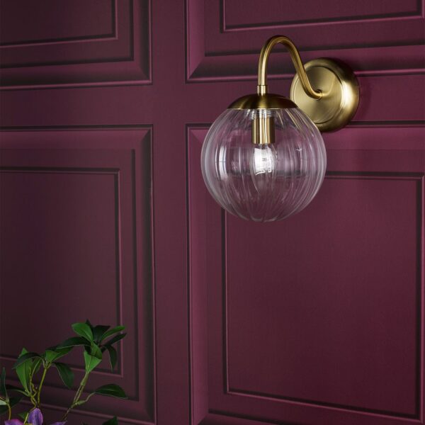 elegant curved arm wall light in natural brass with blown glass globes - Stillorgan Decor