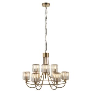 Elegante, neunflammige, gestaffelte Pendelleuchte mit Glasschirmen in Antikmessing-Optik. Stillorgan Decor
